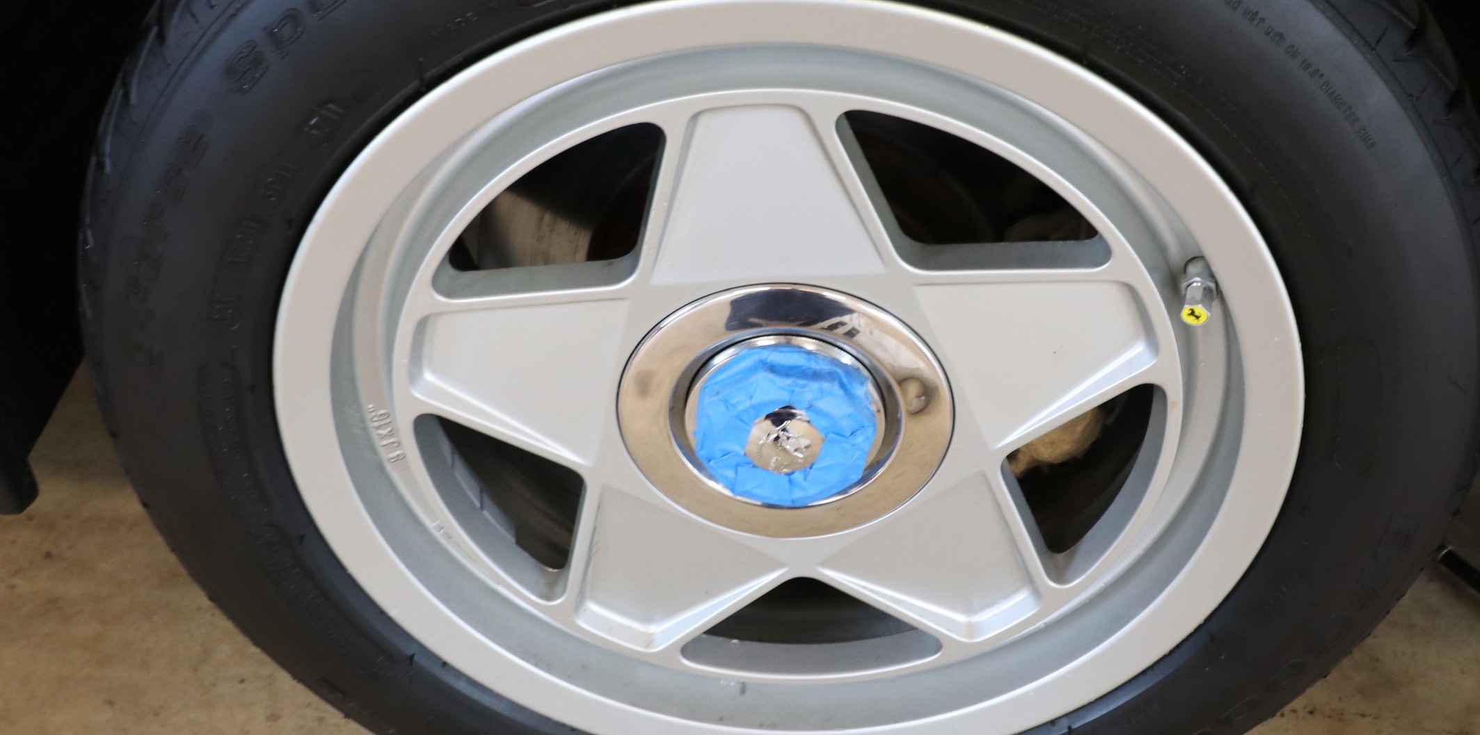 Ferrari Testarossa single wheel nut taped to prevent scratching of the wheel nut